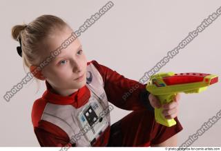 DENISA SITTING POSE WITH GUN